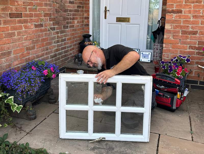 Andy Repairing a double glazed window unit for Derby homeowner