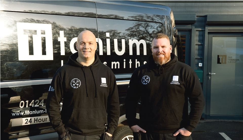 Terry Elliston and Billy Guenigault Directors of Titanium Locksmiths covering Bexhill on Sea standing by their liveried van outside their premises